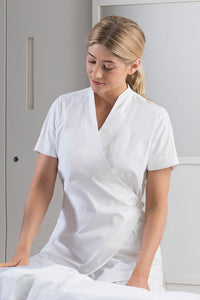 woman in white spa tunic