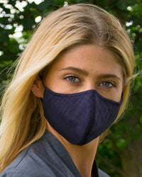 Woman wearing a dark blue face mask